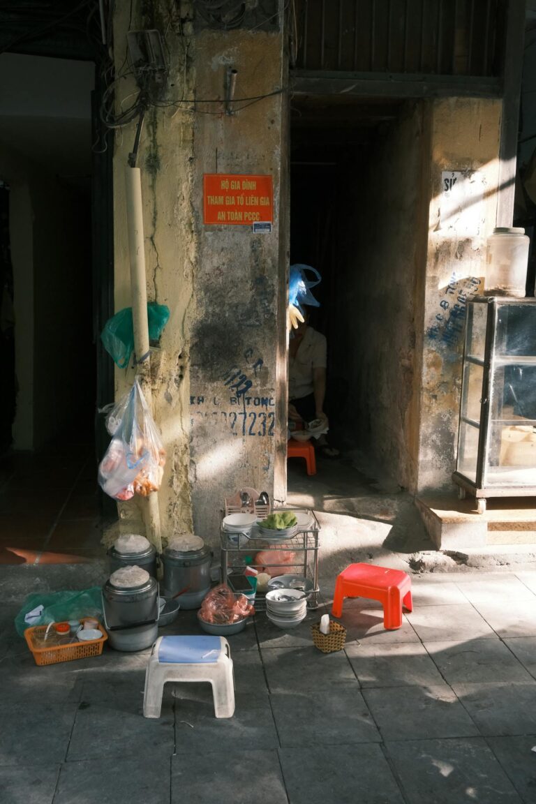 Traditional street food setup in the Old Quarter, Hanoi, Vietnam with rustic charm.